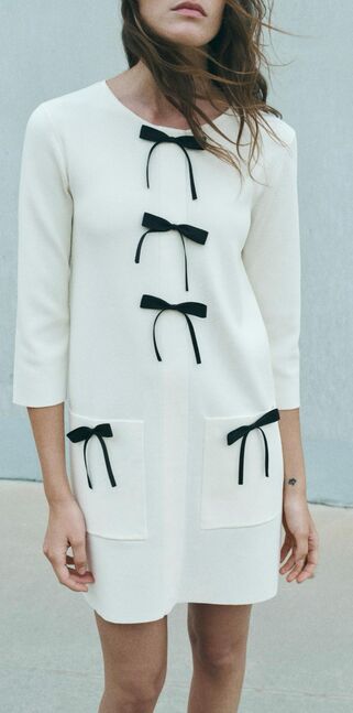 Short knit dress with bows
