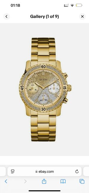 Guess women’s confetti gold dial watch