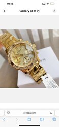 Guess women’s confetti gold dial watch